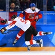 GANGNEUNG, SOUTH KOREA - FEBRUARY 24: Canada's Maxim Noreau #56 hits Czech Republic's Jan Kovar #43 into the boards during bronze medal round action at the PyeongChang 2018 Olympic Winter Games. (Photo by Matt Zambonin/HHOF-IIHF Images)

